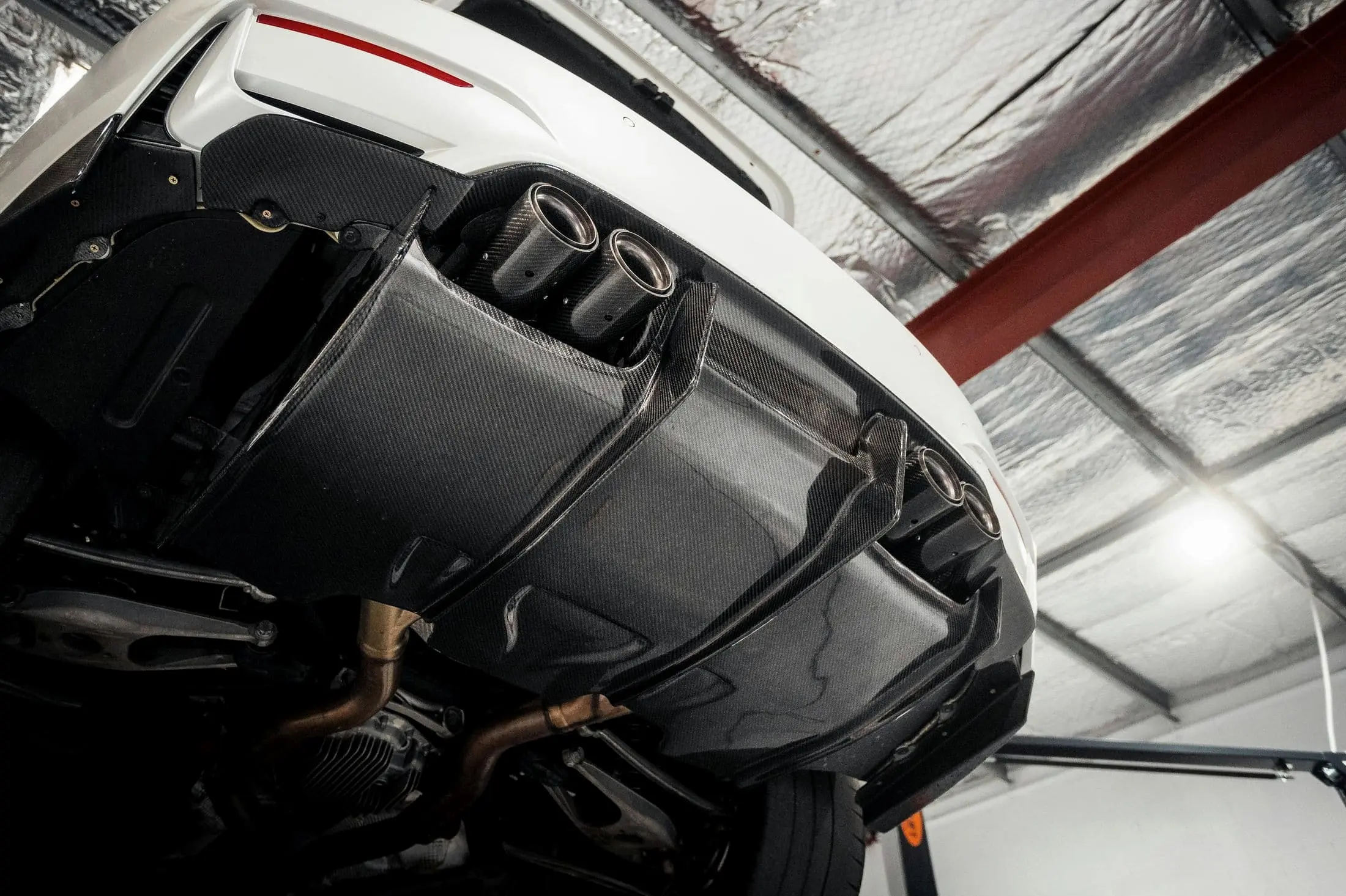 Carbon fibre rear diffuser and titanium exhaust tips from below