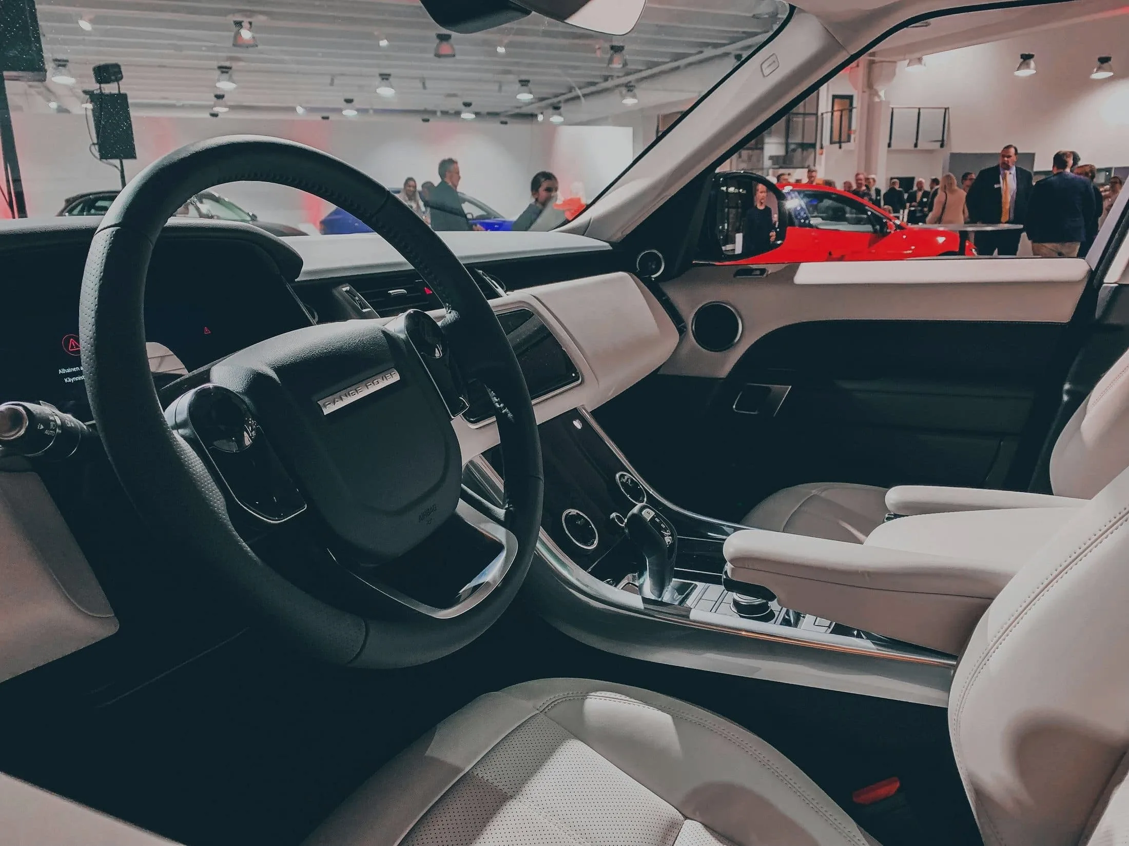 Range Rover cabin in cream leather with a black dashboard